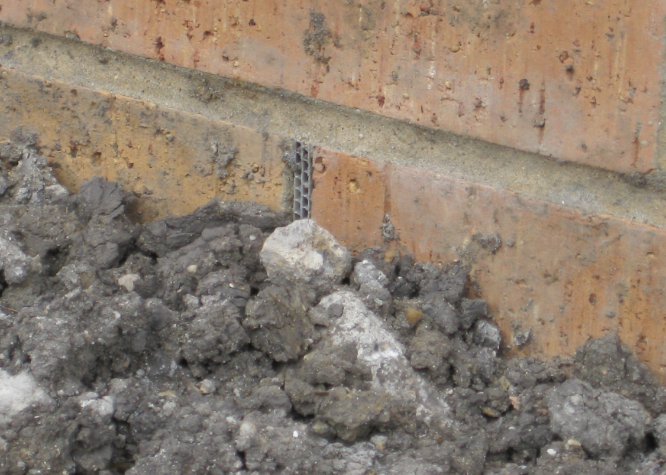 Dirt Covered Weep Holes